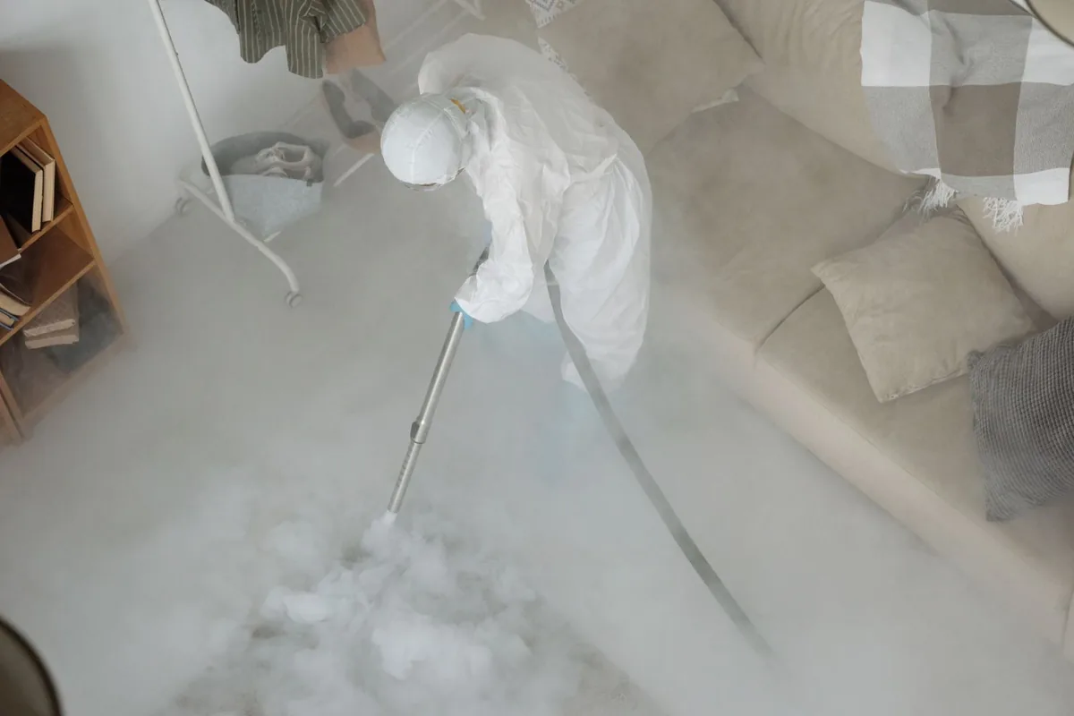 Biohazard cleanup technician in protective equipment, Gregory, TX
